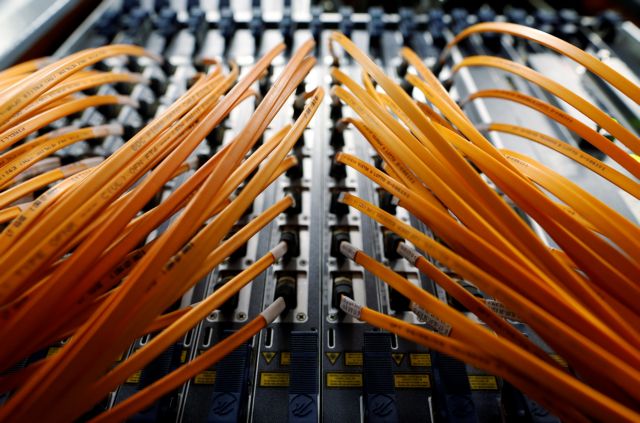 Optical fibre cables of Telecom Italia are seen in a telephone exchange in Rome