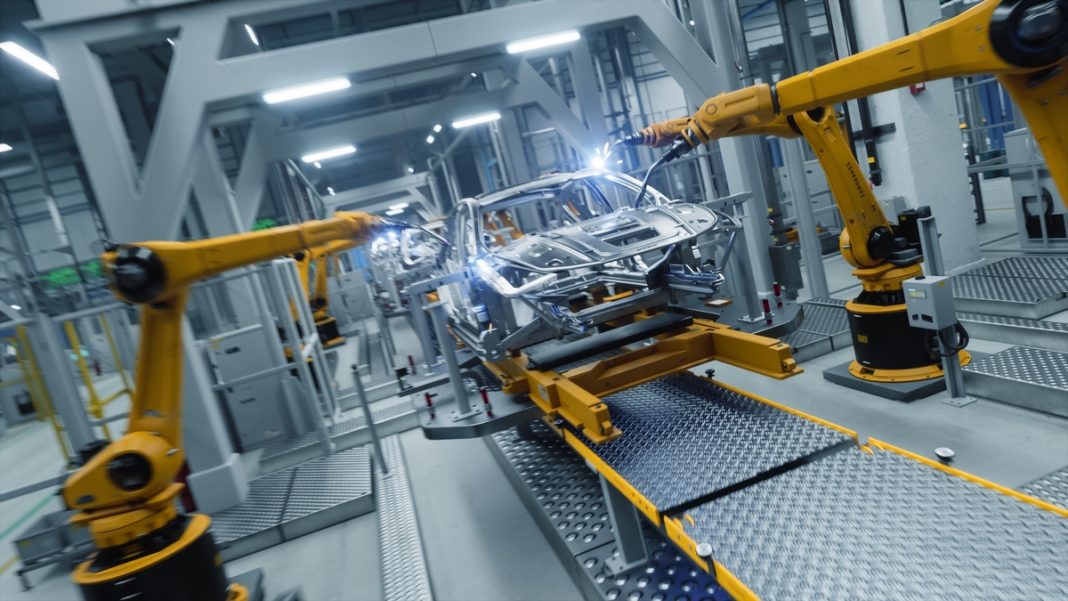 Autonomous,Factory,With,Robotic,Arms,Autonomously,Assembling,Car,Frames,Factory.