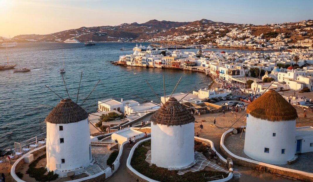 Aerial,View,Through,The,Famous,Windmills,Above,Mykonos,Town,,Cyclades,